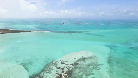 Stunning-Aerial-scene-of-saltwater-lagoon-in-the-middle-of-Los-Roques-Archipelago-Venezuela