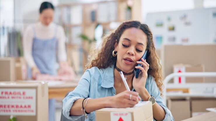 Business, phone call and woman writing