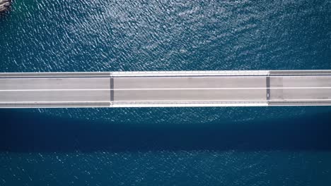 Top-down-aerial-view-of-Pag-Island-Bridge,-Croatia