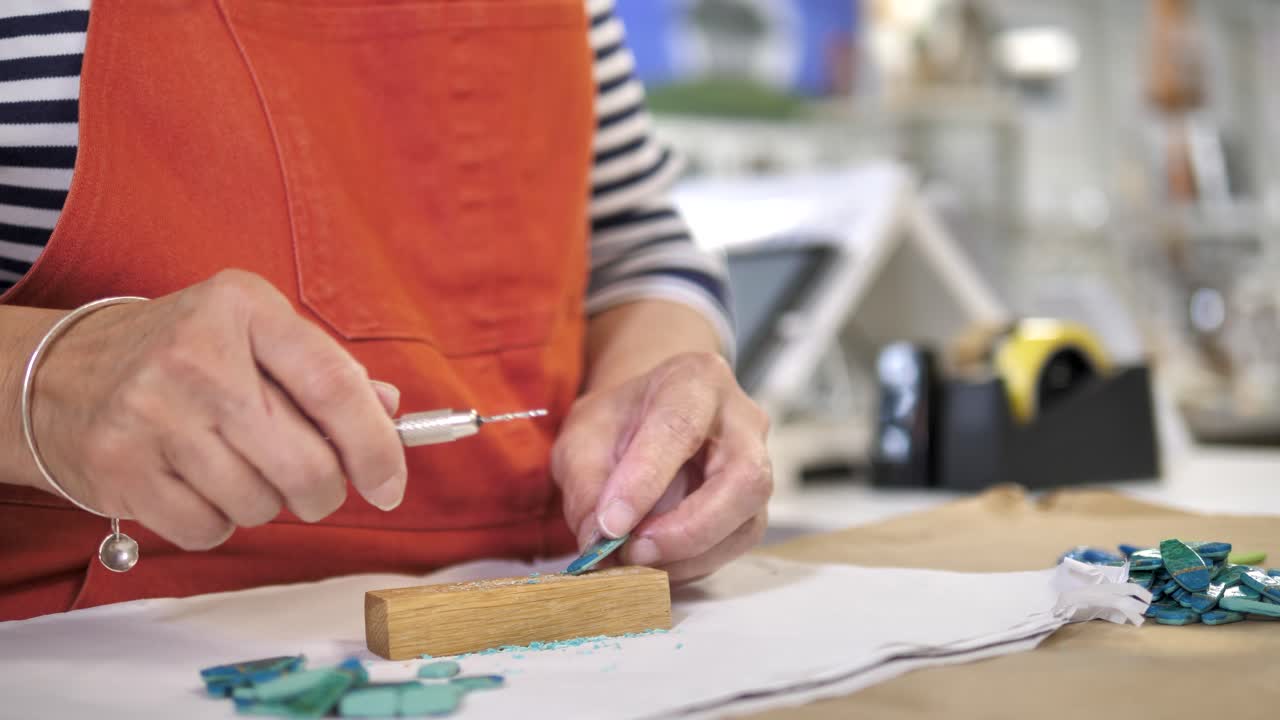 Close-up of Artisan Hands Engaged in Detailed Craft Work