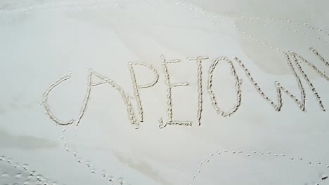 aerial of cape town sand sign on the beach