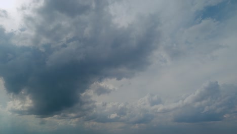 sun rays radiating from behind a cloud obscuring the sun. sun rays through the cloud on dark sky.