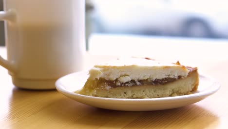 apple tart slice with coffee cup