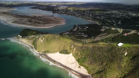 mangawhai heads aerial scenic of township and beachfront in popular area, northland, new zealand