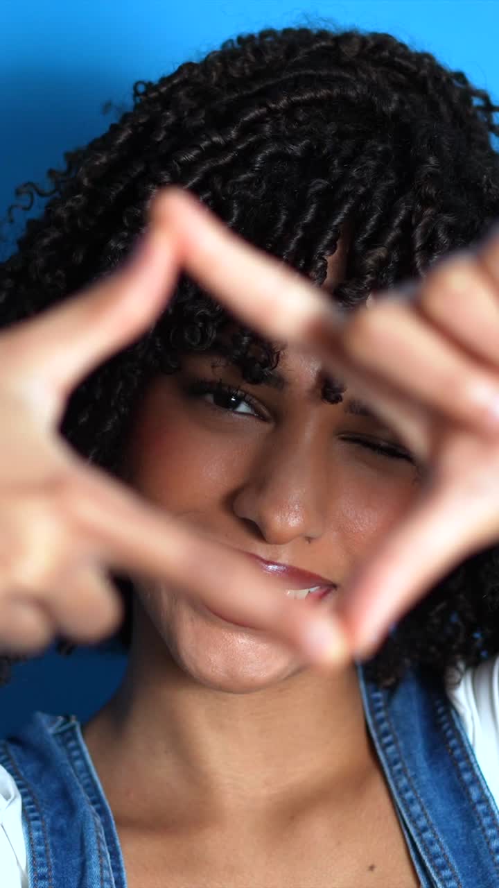 Portrait of a woman making a hand gesture