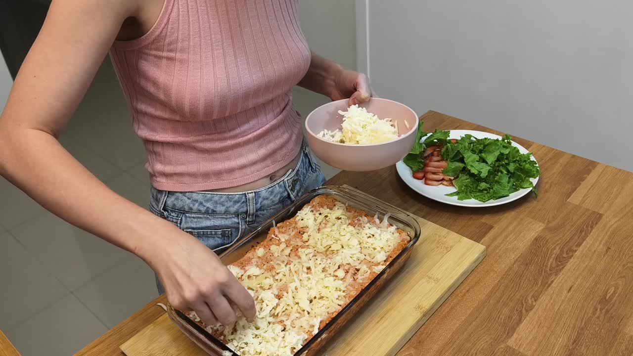 Woman preparing lasagna