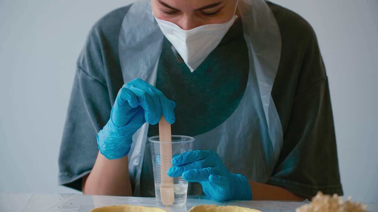 Woman Mixing Epoxy Resin