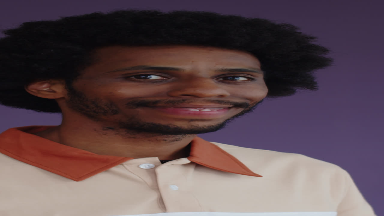 Portrait of Cheerful Black Man Isolated on Purple Background