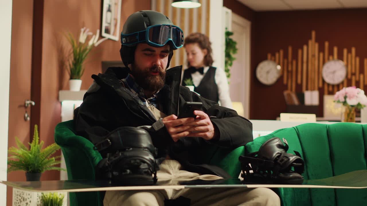 Person texting messages before skiing