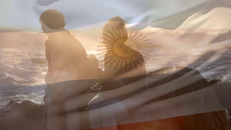 animation of flag of argentina over caucasian parents with child at beach