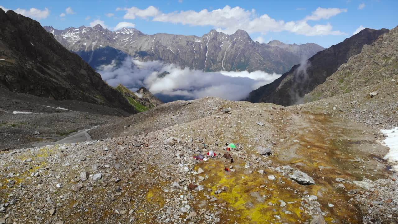 Mountain landscape with clouds and rocky terrain