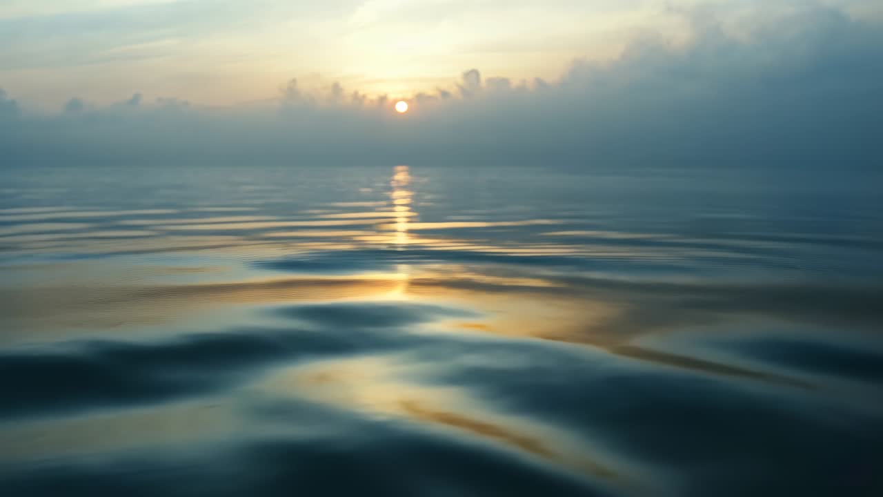 Shimmering ocean surface near horizon reflecting sun, ripples rising, traveling, flattening