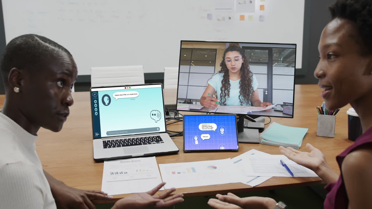 Diverse business people having video call and using laptop with digital chat on screen in office