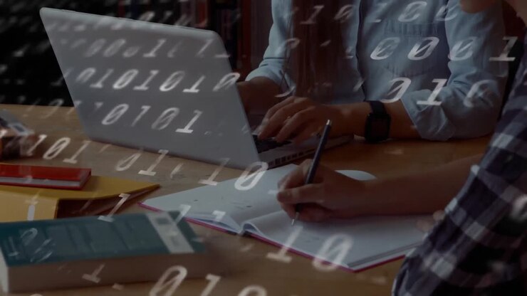 Animation of binary coding numbers changing over students writing and using laptop