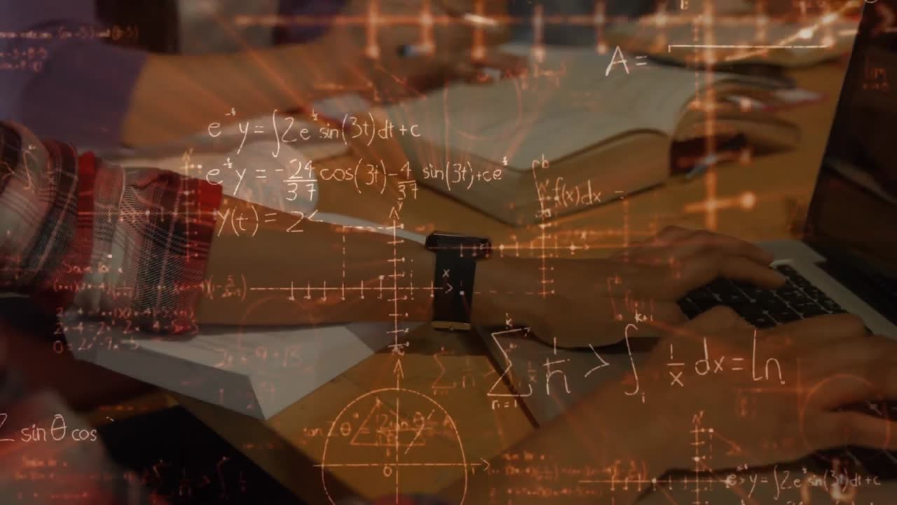 책과 노트북에서 일하는 학생들