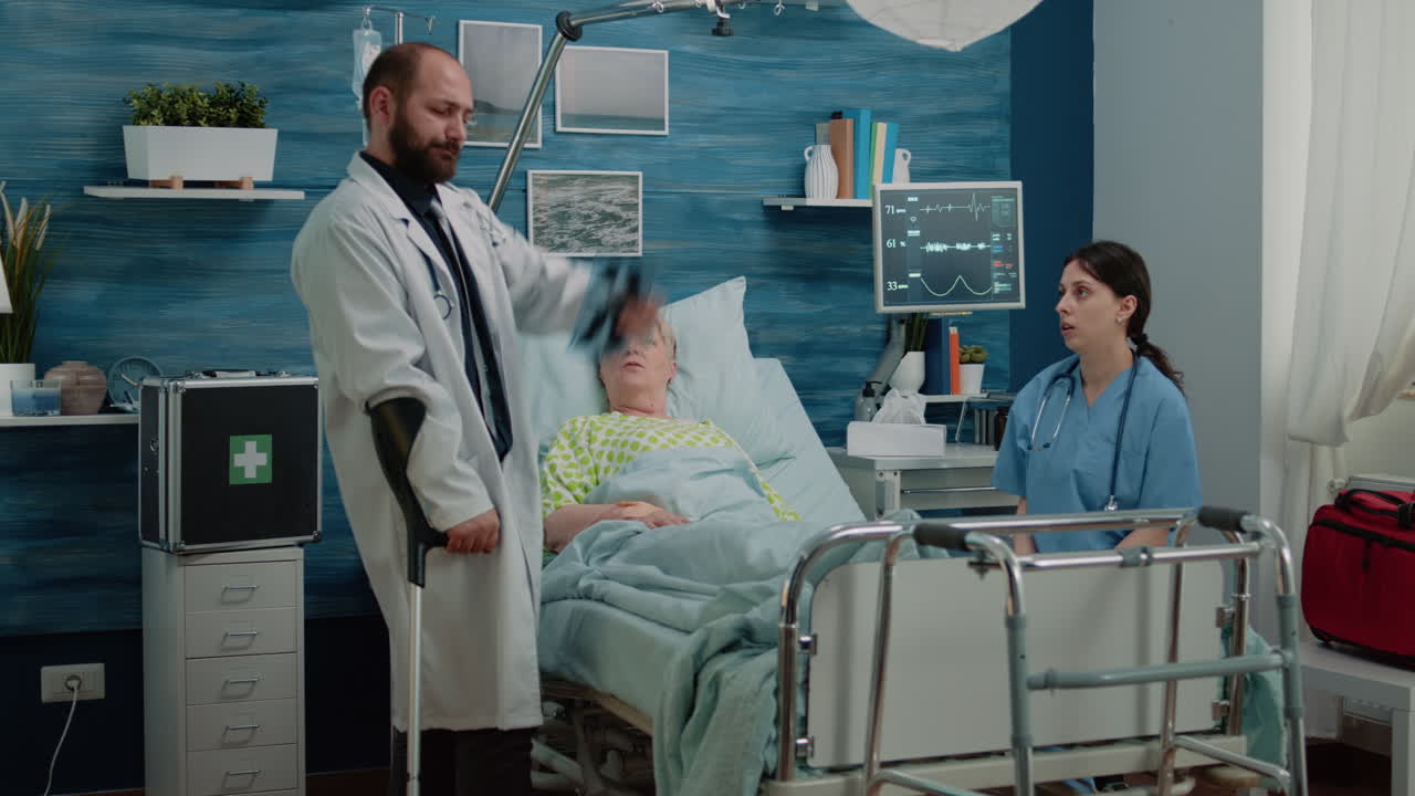 Nurse giving x ray scan to doctor for consultation with aged patient