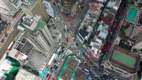 streets with crowd of people and traffic congestion in hong kong
