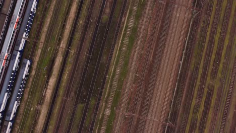 old railway tracks and abandoned trains seen from above