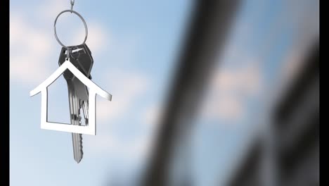 Animation-of-keys-with-house-keychain-over-blurred-background