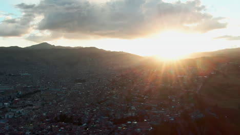 Dreamy-Golden-Hour-in-Cusco,-Peru-Showcasing-a-Glowing-Sunflare