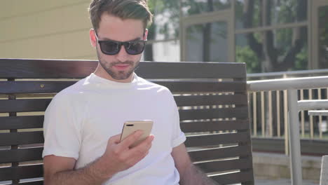 man using smartphone outdoors