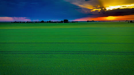 taking off to a new world of sustainability - rising drone hyperlapse over farmland fields