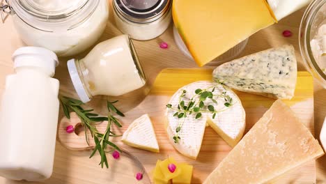 various dairy items displayed on a wooden surface