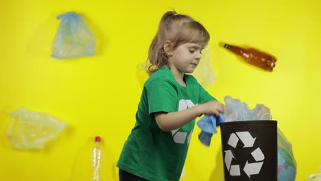 Girl-activist-in-cellophane-packages-on-her-neck-makes-Earth-globe-free-from-plastic-package