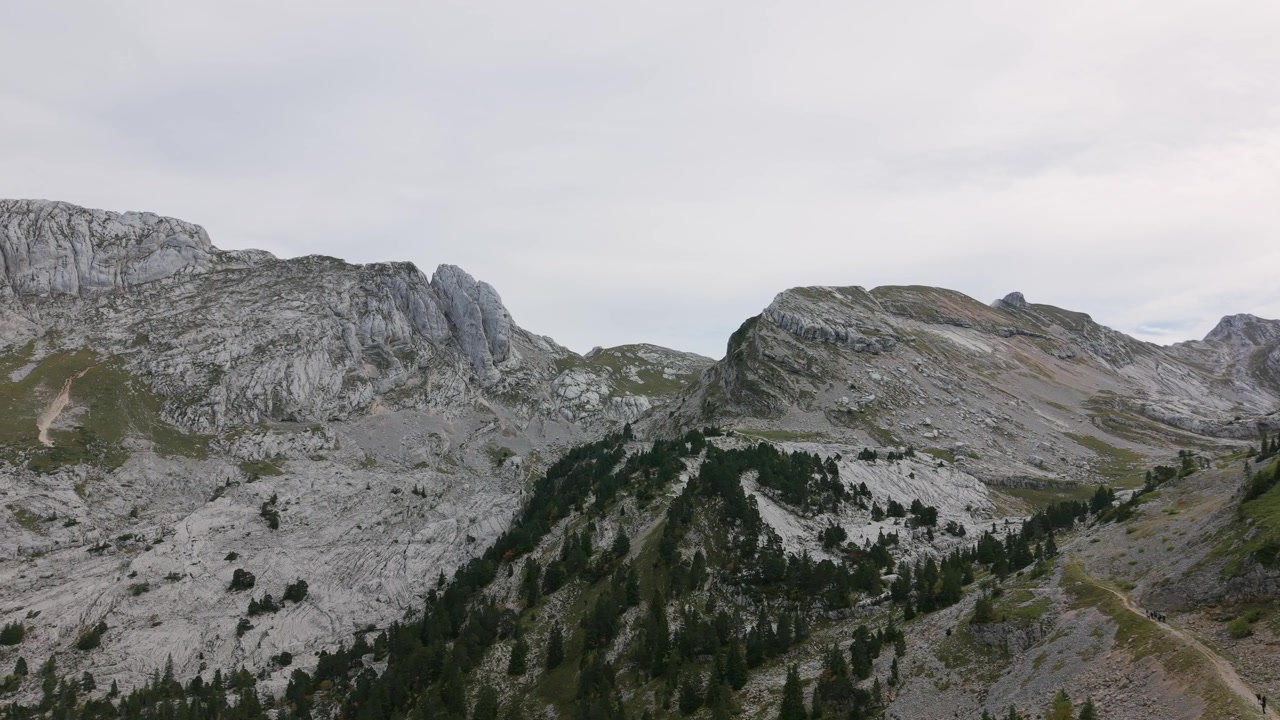 This captures a vast mountain landscape in the Auvergne Rhône Alpes region of France. aerial