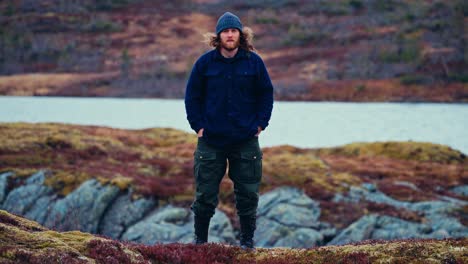 man standing near the lake in åfjord, norway - wide shot