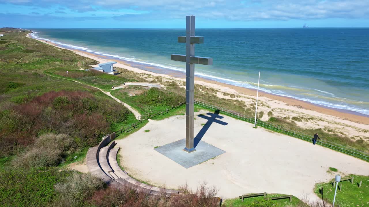 Cross of Lorraine, monument overlooking Juno Beach on Graye-sur-Mer, historic site and symbol with free France. Aerial drone orbiting