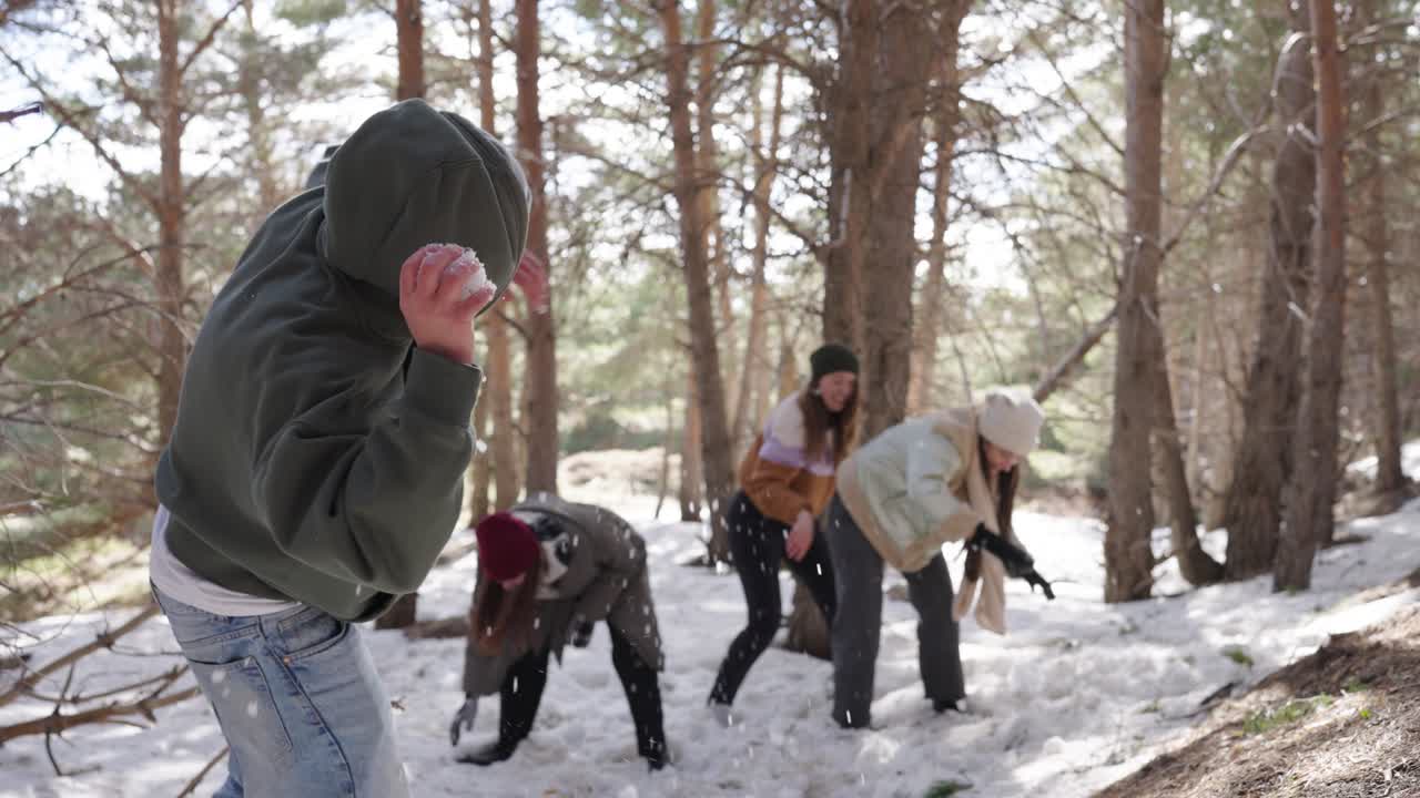 Group Snowball Fight in Winter Forest