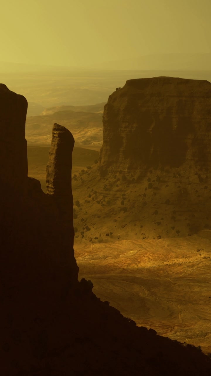 Landmarks and shadows in desert landscape during sunset hour