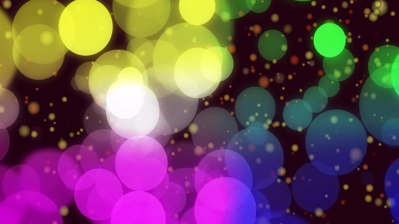 Multicolored glowing bokeh circles dancing across dark backdrop, featuring shimmering light spots