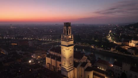 aerial pullback drone shot of verona main's cathedral at sunset