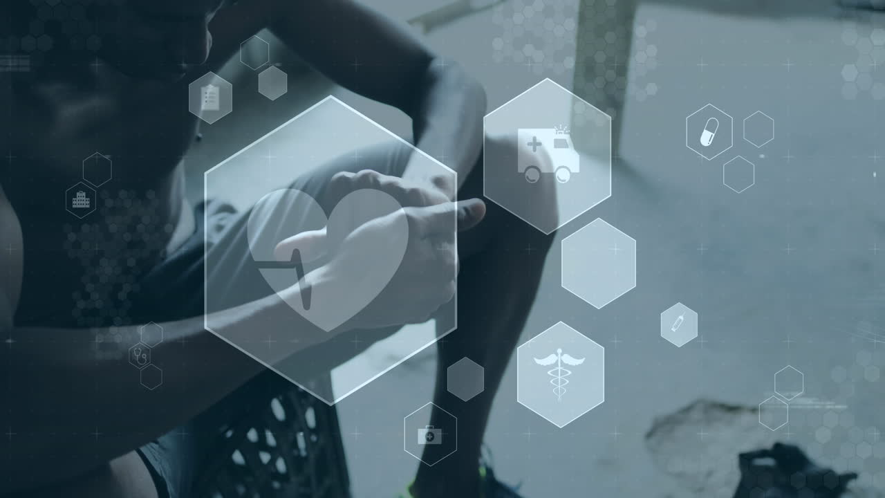 animación de iconos médicos y de salud sobre un hombre afroamericano que se pone guantes de boxeo en el gimnasio