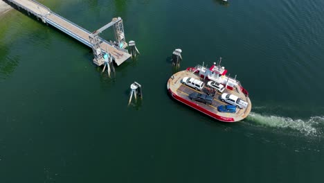 aerial view of the charlie wells ferry pulling up to the herron island dock