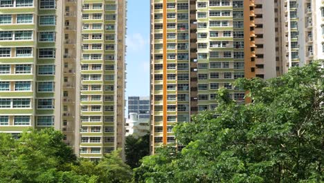 Low-angle-view-of-signapore-residential-buildings-against-blue-sky-,