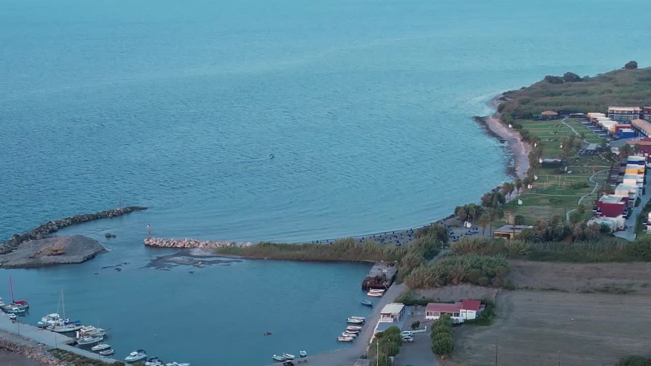 Scenic aerial view of a coastal area in Greece with boats and calm waters