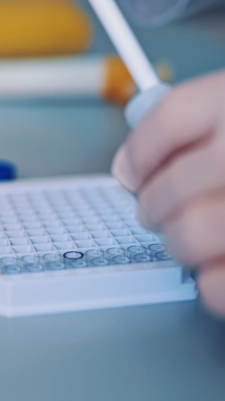 Science laboratory research. Close up view of scientist holds and examine samples Vertical video