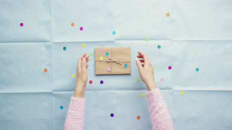 top view woman holding birthday present planning party hands from above - red epic dragon