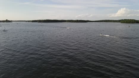 Two-boats-sailing-at-the-lake-aerial-view