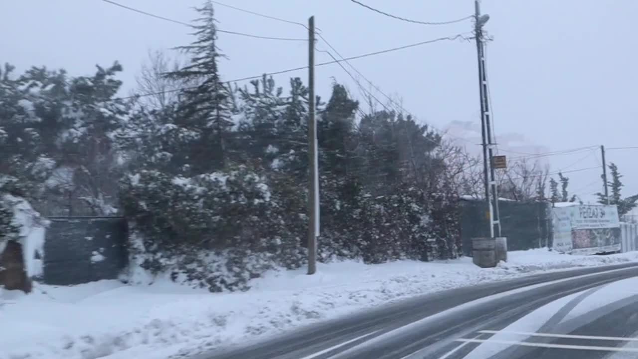 Traveling Through Snowy Road In Anatolian Side Of Istanbul, Turkey During A Stormy Winter - Tracking Forward Shot