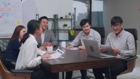 asian business having conference video call meeting brainstorming ideas about new project colleagues working together planning strategy enjoy teamwork in office.