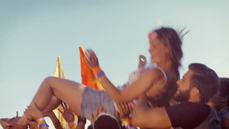 in high quality format happy hipster woman crowd surfing