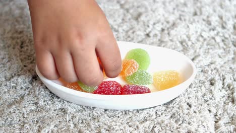 colorful fruit jellies in a white bowl