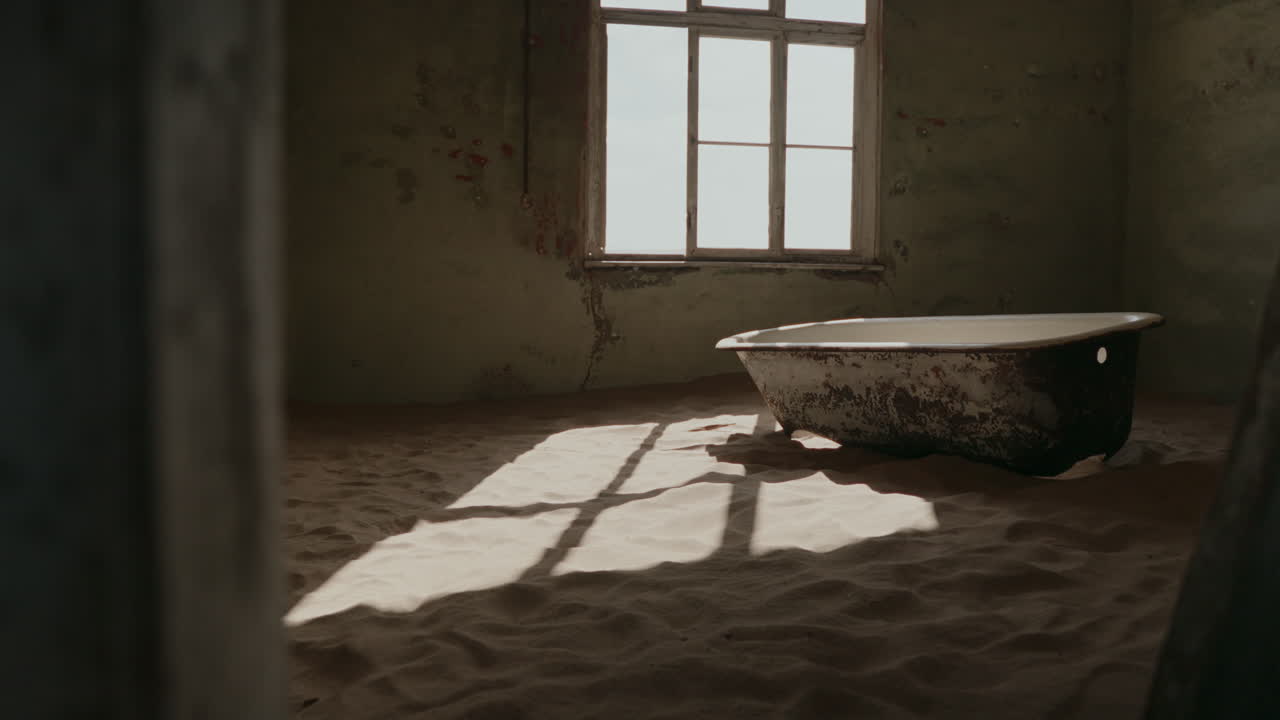 Abandoned House in the Desert with a Bathtub Covered in Sand