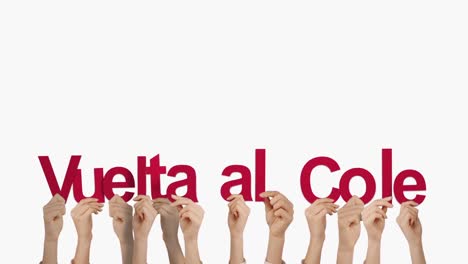 Hands-holding-up-vuelta-al-cole