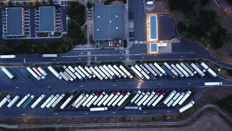 aerial view of a busy truck stop at dusk