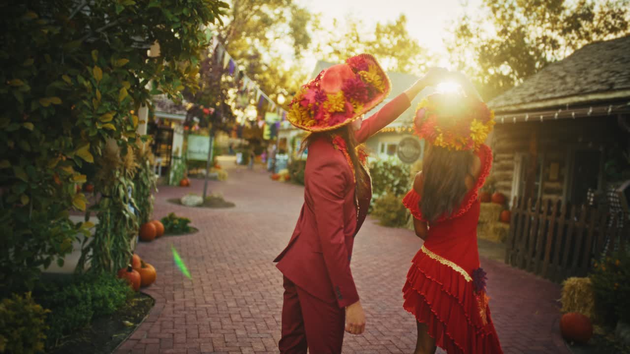 Couple Dancing in Day of the Dead Costumes